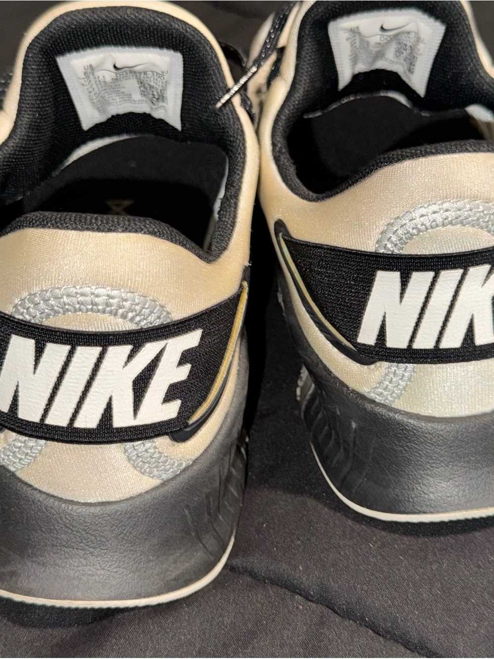 Nike Black and Cream Low-Top Sneakers with Bold Heel Logo